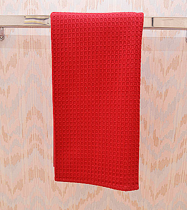 Festive colored waffles weaves kitchen towel. Red color